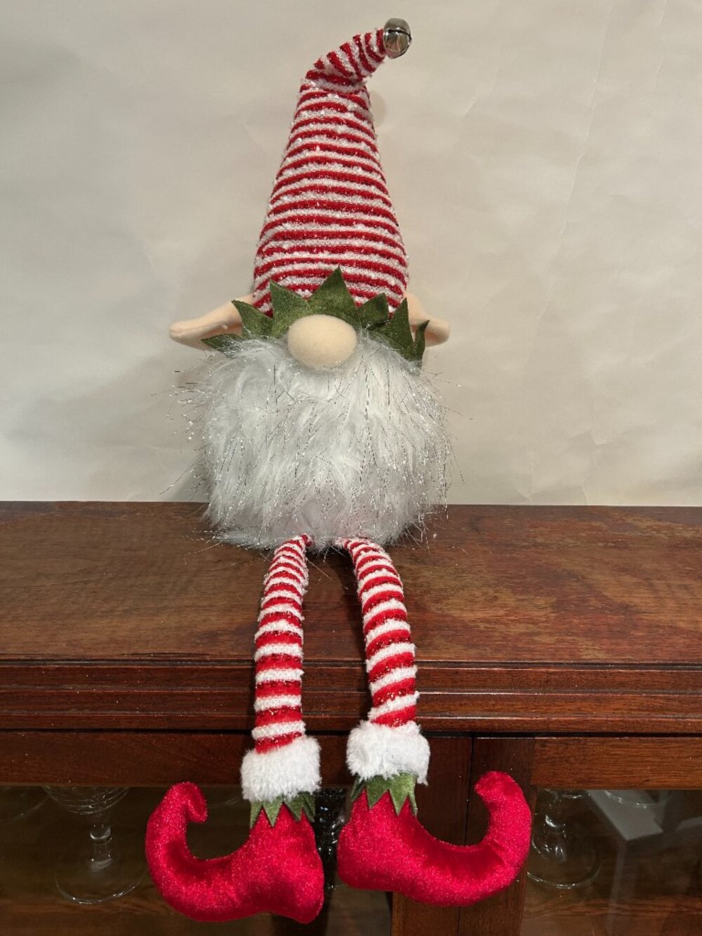 Christmas Holiday Gnome with red and white striped cap and wispy, sparkly white